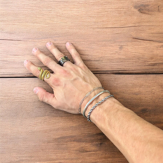 Trio of stainless steel bracelets in silver.