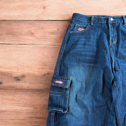 Vintage style baggy wide leg skater fit cargo jeans with embroidery in mid blue.