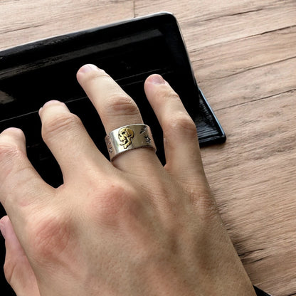 Stainless steel gothic skater skull ring in silver with gold accent. One size.