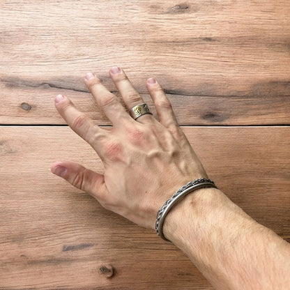 Stainless steel gothic skater skull ring in silver with gold accent. One size.